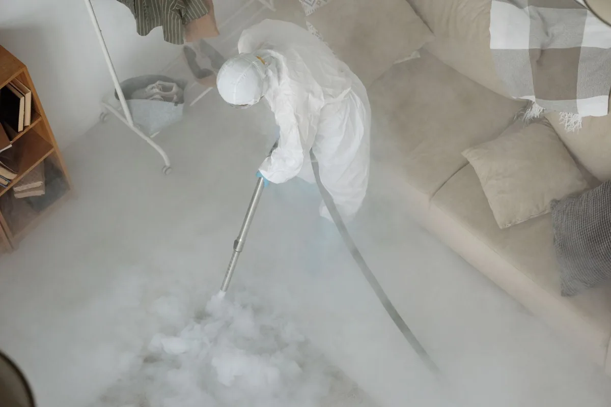 Biohazard cleanup technician in protective equipment, Bridgeport, MI